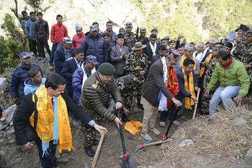 Finance Minister Ram Sharan Mahat (right) and Chief of Army Staff Gaurav SJB Rana inaugurate the construction of the Mailung-Syabrubesi road on Friday.