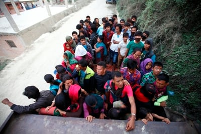 SQUEEZED UP: A lorry carries passengers who return from Manakama Temple after celebrating Nepali New Year in Lalitpur on Sunday.