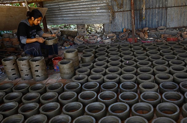 A worker makes electric cooking heaters using clay at a workshop in Thimi on Friday.According to the workers, the demand for the electric stove has grown after the cooking gas and fuel shortages caused by the ongoing blockade.
