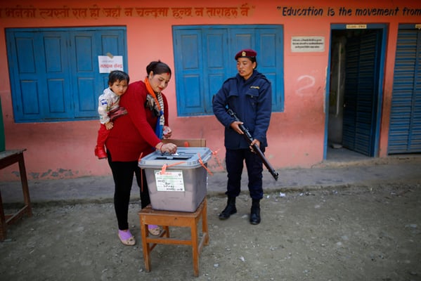 A woman casts her vote in a polling station in Beni during the first phase of parliamentary and provincial elections on Sunday.