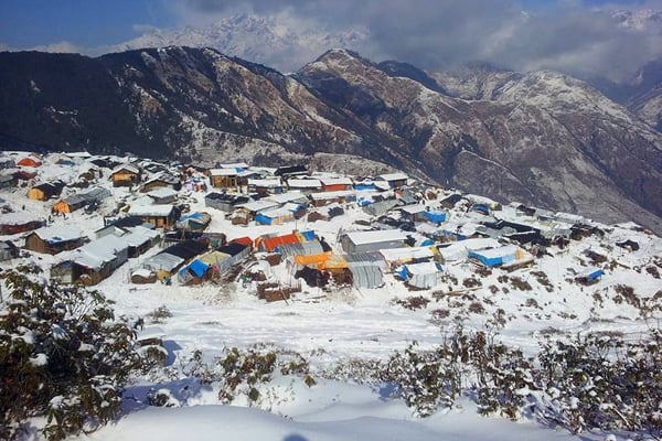 Gupsipakha village in Laprak, Gorkha is covered with snow on Saturday. Nearly 500 earthquake survivors living in temporary tents shiver with cold after rains, hailstones and then snowfall.