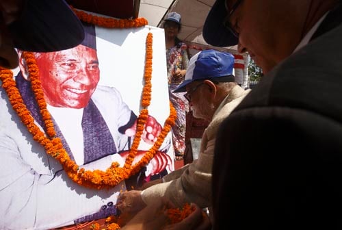Prime Minister Sushil Koirala offer flowers to the portrait of late Nepali Congress leader Ganesh Man Singh at Shanti Batika on Friday.