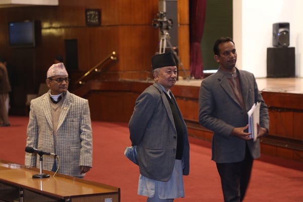 Law Minister Ajaya Shankar Nayak (right) walks to the rostrum to table the second amendment to the constitution bill in Parliament on Sunday.