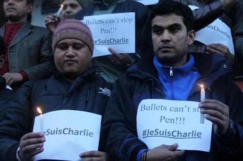 Members of the Federation of Nepali Journalists hold a candlelight vigil for victims of the Charlie Hebdo shooting in Basantapur on Friday.
