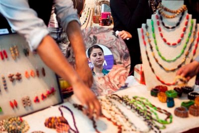 ONE LOOK: A woman, unaware of her reflection in a mirror, looks at products made of paper at the International Trade Fair at Bhrikuti Mandap on Wednesday.