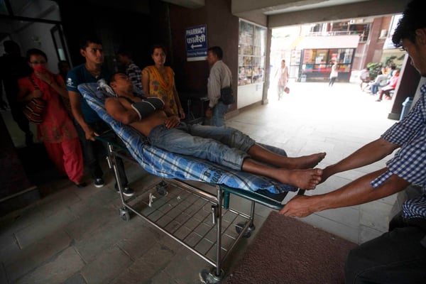 The wounded from the Bhote Koshi landslide receiving treatment at B&B hospital on Saturday.