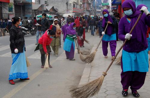 Workers cleaning the road ahead of next week's SAARC summit on Saturday.