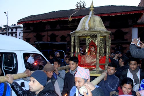 The living goddess Kumari is carried on a chariot at Basantapur Darbar Square on Monday.