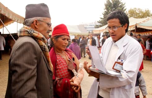 DOCTOR'S ORDERS: Two patients attend the free medical camp organised by the Nepal Medical Association on Thursday at Tundikhel.