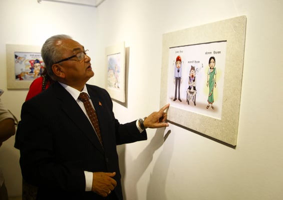 Minister of Foreign Affairs Mahendra Bahadur Pandey attends "Chitra Bichitra", an exhibition of educational cartoons at Nepal Art Council, Babarmahal on Monday.
