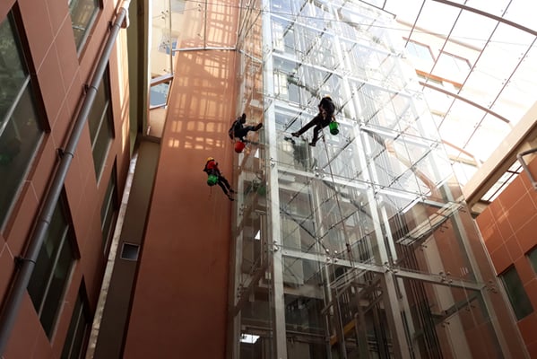 Workers clean the elevator shafts at Nepal Medciti Hospital, Lalitpur on Sunday.