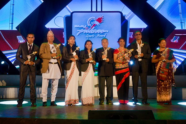 Winners of the 14th edition of the Nepal Journalists Forum (NSJF) Pulsar Sports Award pose for a group photo in Kathmandu on Monday. Footballer Kiran Kumar Limbu and shuttler Nangsal Devi Tamang were declared male and female player of the year.