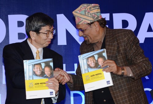 Finance Minister Ram Sharan Mahat and ADB President Takehiko Nakao launching the ADB-Nepal partnership publication in Kathmandu on Tuesday