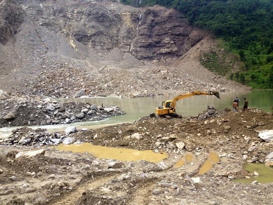 The Nepal Army continue to use excavators to remove debris from the Sunkoshi dam area to drain out water from the blocked river on Tuesday.