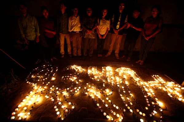 People light candle to mark the International Day of the Disappeared in Kathmandu on Wednesday. Over 1,300 people were disappeared during the 1996-2006 conflict.