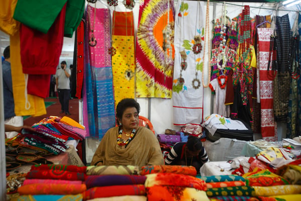 A woman waits for customers in her stall during the 13th Handicraft Trade Fair and 11th Craft Competition organised by the Federation of Handicraft Associations of Nepal (FHAN) in Bhrikuti Mandap on Monday.