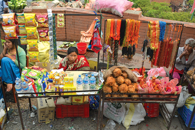 NO DISCOUNT: Women vendors sell junk food and puja items near Manakamana temple on Sunday.