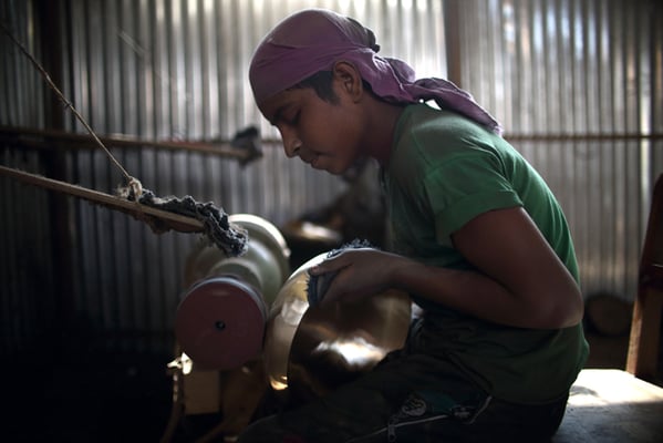 Mohammad Umar,15 from Uttar Pradesh India polishes a singing bowl at the factory in Lubu on Monday.