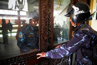 NO ENTRANCE: Police secure the door of Tribhuvan University Central Office building during a protest by Students Union at Kirtipur on Tuesday.