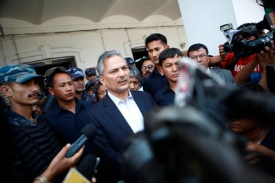 ON-ON: Former PM Bhattarai talks to journalists after his party registered for the upcoming elections at the EC on Tuesday.