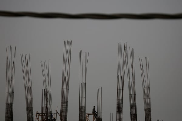 A lone labourer works at a construction site in Kathmandu on Tuesday.