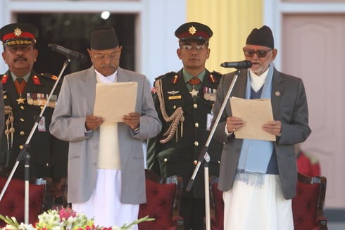 I PROMISE: President Ram Baran Yadav (left) administers the oath of office and secrecy to the newly elected Prime Minister Sushil Koirala at Shital Niwas on Tuesday.