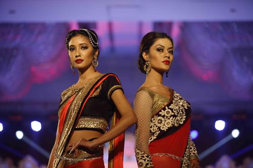 Models pose in traditional Indian attire during the Style Mantra Fashion Show at Hyatt Regency on Saturday.