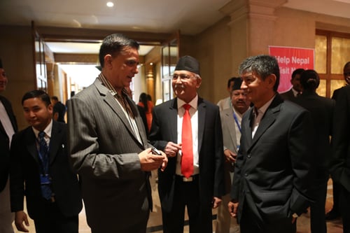 Comedian duo Madan Krishna Shrestha and Hari Bansha Acharya with UML leader KP Oli on the sidelines of International Conference on Nepal's Reconstruction in Kathmandu Thursday.