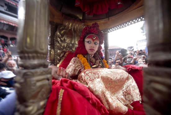 The Kumari looks on as her chariot is taken around Basantapur during the Seto Machendranath festival on Sunday.
