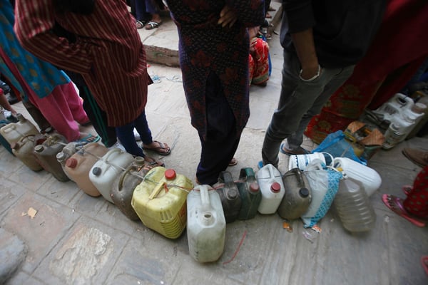 People line up to buy kerosene in Jaisideval, Kathmandu on Friday. India's blockade has caused an acute fuel crisis in Nepal.