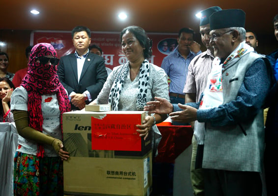 Youth Association Nepal of CPN (UML) provided computers for acid attack victims Sangita Magar and Sima Basnet at an event on Saturday in Kathmandu.