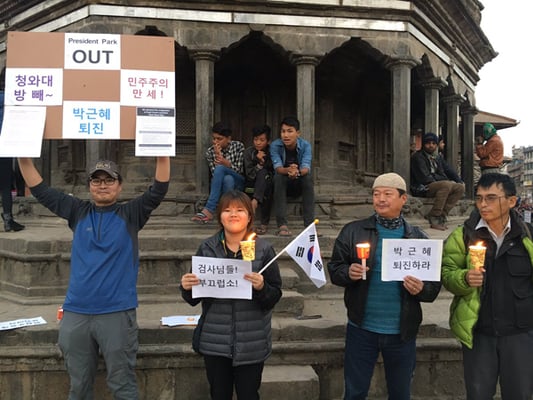 South Koreans stage a demonstration in Kathmandu on Saturday calling for resignation of their President Park Geun Hye.