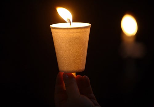 A devotee holds a candle during a Easter celebration ceremony organised at a Catholic church in Dhobighat, Kathmandu on Saturday.