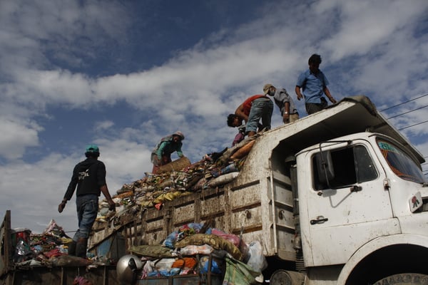 DIRT PILE: Employees of the Kathmandu Metropolitan City pick up garbage from Satdobato on Thursday.