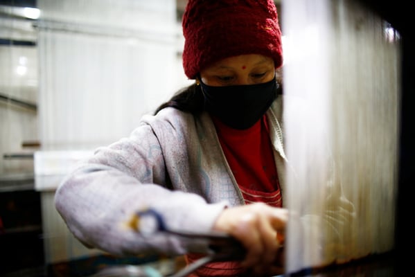 34-year-old Kumari Byanjankar weaves a carpet in a factory at Banglamukhi, Lalitpur on Monday.
