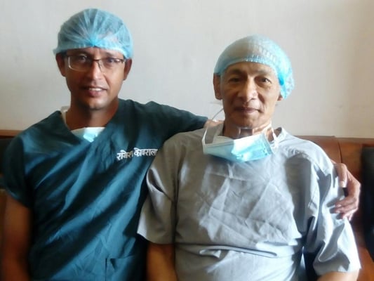 'Serial killer' Charles Sobhraj (right) poses for a photo on Monday after his successful heart surgery at a hospital in Kathmandu. Dr Raamesh Koirala who operated on the Frenchman shared this photo on Twitter and wrote: "Yes, he has a heart and I just fixed valves inside'.