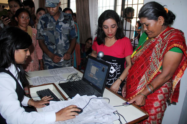 REGISTERED : A woman provides her digital fingerprint for the voters list at district election office in Babarmahal on Monday.
