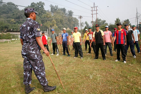 EYES FRONT: A policeman from the Swayambhu police beat trains temporary police in election security, at Bhuikhel on Wednesday.