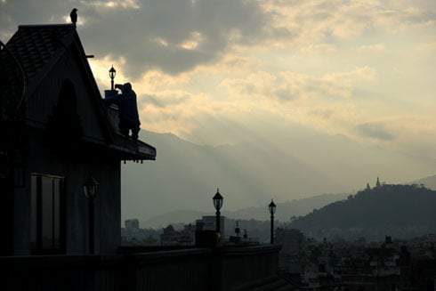 LAST SHIFT : A man working on a rooftop of a house near Thamel on Monday evening.