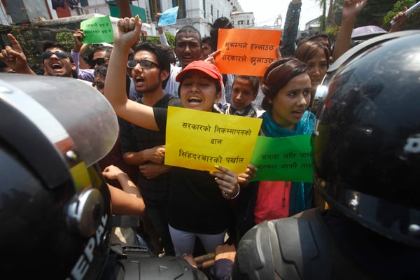 On the first anniversary of the Nepal earthquake, youth protest the government's apathy towards earthquake survivors in Kathmandu on Sunday.