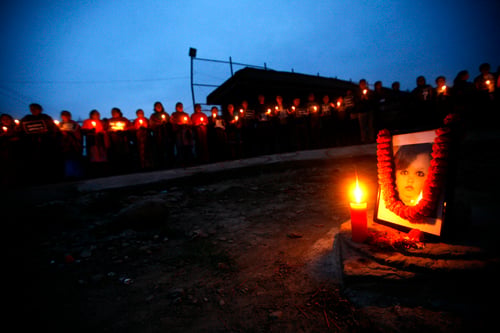Youths organise a candle light march in Jawalakhel, Lalitpur on Sunday evening demanding justice for the seven-year-old rape victim Puja Sah.
