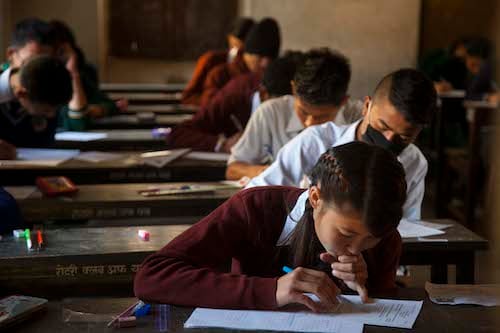 Students take the first paper of their SLC examinations on Thursday.