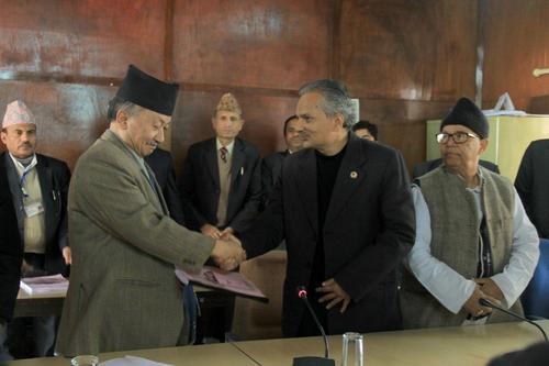 Dialogue Committee Chair Baburam Bhattarai handing over the discussion and recommendations on the issues of the constitution to Speaker Subhas Nembang on Friday.