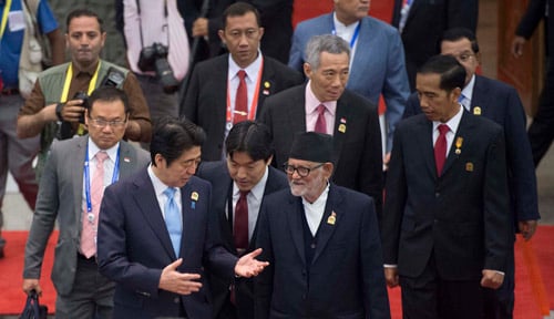 Prime Minister Sushil Koirala chats with Japanese Prime Minister Shinzo Abe as they arrive at the venue of Asian-African Summit in Jakarta, Indonesia on Wednesday.