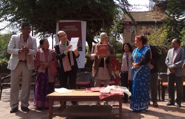 Cultural historian Satya Mohan Joshi and Secretary of Ministry of Culture, Tourism and Civil Aviation Shankar Prasad Adhikari launch the book 'Nepali painting through the ages' by Madan Chitrakar at Patan Museum on Saturday.