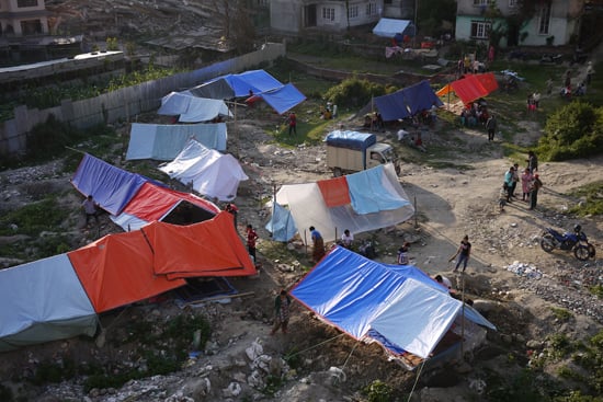 People camp out in open areas following a second powerful earthquake that rattled Nepal on Tuesday.