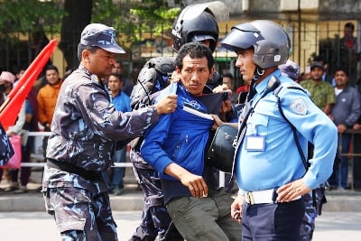 WATCH OUT: A man is hauled by police officers outside Ratna Park, Kathmandu at the start of the bandh on Thursday at noon.