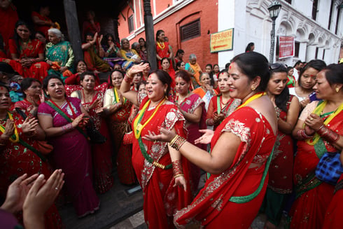 RED FEVER: Women sing and dance to celebrate the Teej festival, in Pasupatinath on on Sunday.