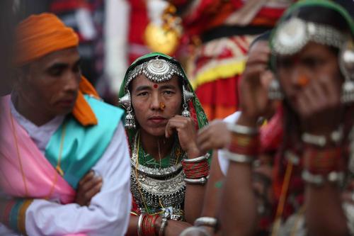 A woman waits before performing a traditional dance during the National Cultural Festival at Basantapur Darbar Square on Sunday.