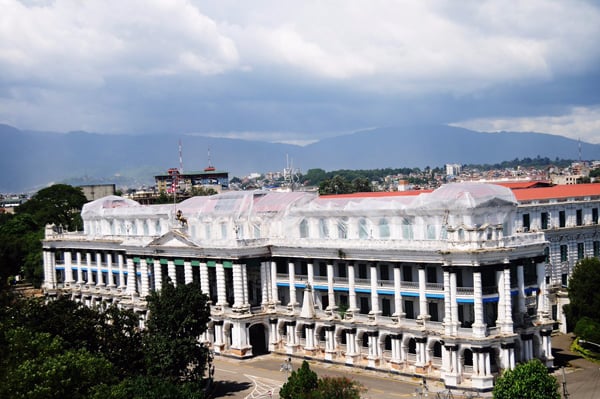 After monsoon downpours threatened this earthquake-damaged portion of Singha Darbar, it has been covered with huge plastic sheets. Ending a prolonged dispute over whether it should be rebuilt or retrofitted, the National Reconstruction Authority has recently opted for the latter.